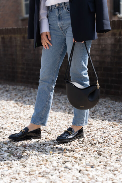 Black loafers and Arket jeans